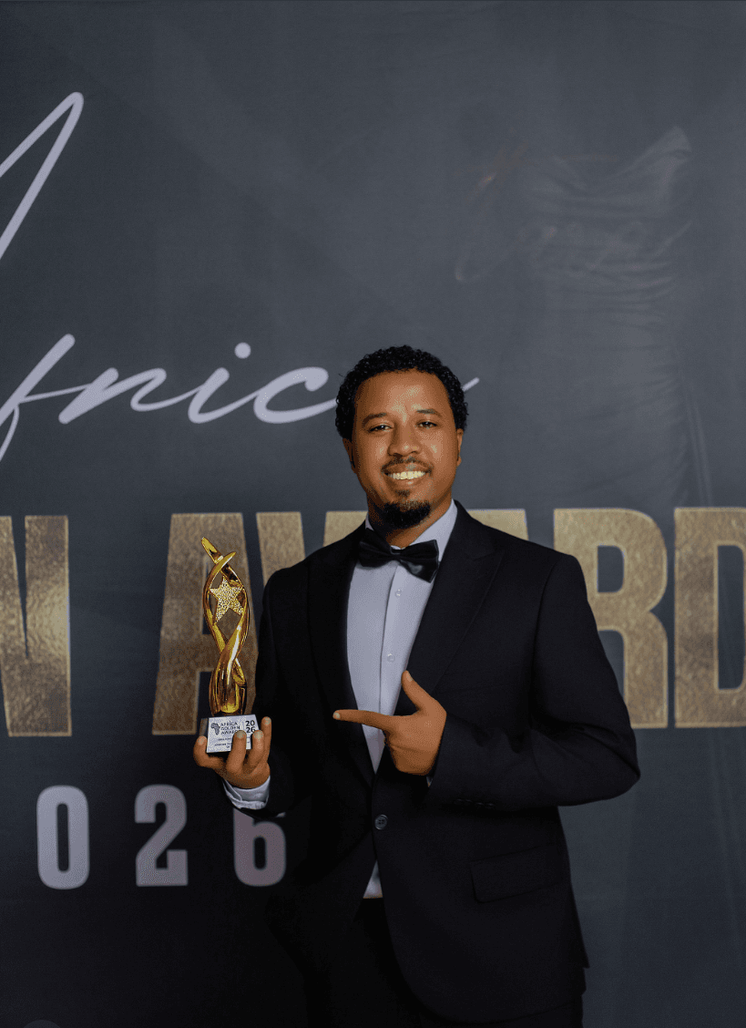 Abel Birhanu holding the African Travel Influencer of the Year trophy at the Africa Golden Awards 2026